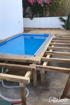 a wooden table with a blue pool in it