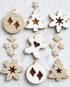 christmas cookies and decorations on a marble surface