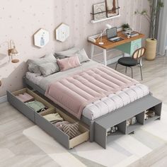 a bedroom with a bed, desk and drawers on the bottom shelf in front of it