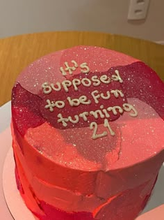 a heart shaped birthday cake with the words, it's supposed to be fun turning 21