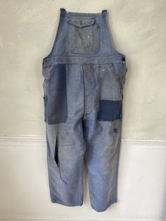 Hello and welcome to the Textile Trunk! Please follow us on Instagram, we are @textiletrunk As hipster as they get! Rustic, primitive wear ~ This textile is a lovely pair of vintage French overalls!! The top straps are all missing, but these are still a lovely treat! Made from a beautiful heavy weight indigo denim moleskin! ~~ These overalls date to the 1940s or a bit earlier~ There are two front pockets at the waist, and a button pocket on the bib. ~ lovely for creative hands to add some straps Indigo Cotton Overalls With Pockets, Vintage Cotton Jeans With Pockets, Vintage Denim Blue Overalls With Pockets, Vintage Denim Blue Jeans With Pockets, Vintage Blue Cotton Overalls, Vintage Blue Cotton Jeans, Retro Blue Cotton Overalls, Vintage Dark Wash Bottoms With Patch Pockets, Vintage Washed Cotton Overalls