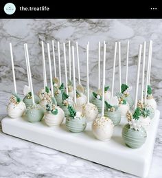 there are many green and white cake pops