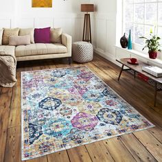 a living room filled with furniture and a large rug