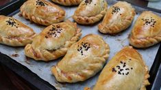 there are many pastries on the baking sheet