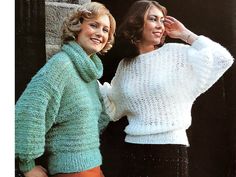 two women standing next to each other wearing sweaters