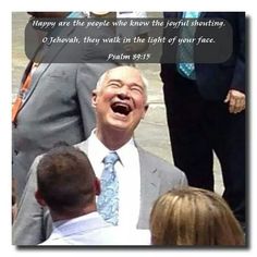 a man laughing while standing in front of people with his mouth open and the caption says, happy are the people who know the light that shining shining