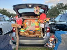 the trunk of a car with winnie the pooh decorations