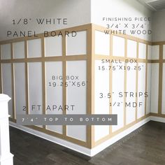 a room with white paneled walls and wood trimmings on the wall is shown