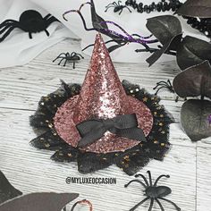 Embrace your witchy side with this flashy Pink Glitter and Black Tulle Witch Hat - perfect for casting spells on Halloween (or any day really, let's be real). Witch hat is supplied on a alligator clip, if you would like the witch hat to be on a headband please purchase that here https://www.myluxeoccasion.co.uk/products/add-on-black-headband-for-witch-hat-halloween Important Information about Witch Hat - Pink Glitter with Black Tulle - Halloween: Witch hats measure approximately 4.25" wide and 3.25" high *Safety Warnings*This hair accessory is NOT a toyCHOKING HAZARD-Contains small partsChildren should not be left unattended whilst wearing hair accessories. Remove this product before sleeping or when in a car seat. Not suitable for children under 3 years old Casting Spells, Witch Hats, Uk Products, Black Headband, Black Tulle, Be Real, Witch Hat