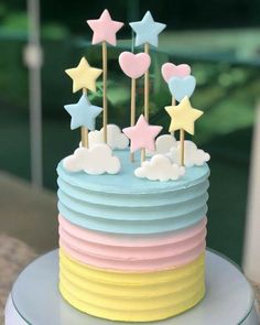 a cake with stars and clouds on top