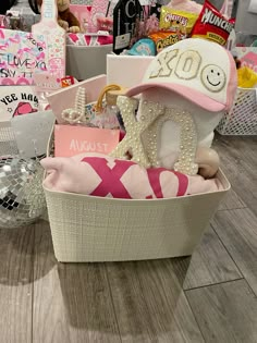 a basket filled with lots of items on top of a wooden floor