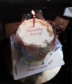 a birthday cake with a single candle on it