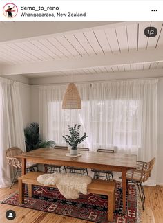 a dining room table with chairs and a bench