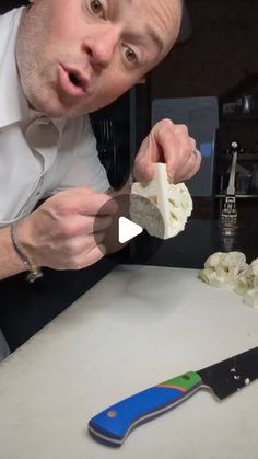 a man is cutting up some food with a knife