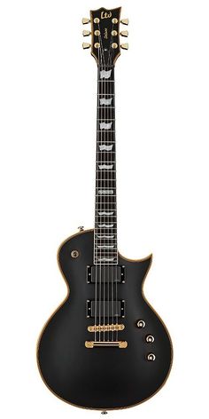 an electric guitar that is black with gold trimmings on the body and neck