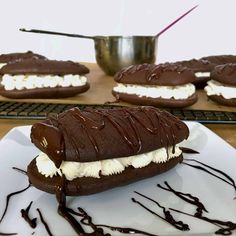 chocolate covered marshmallows are sitting on a plate