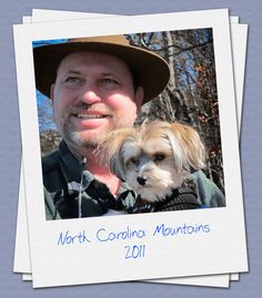 a man holding a small dog in his arms with the caption north carolina mountains 2011