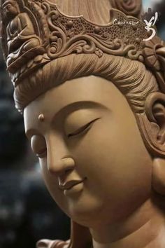 a buddha statue is shown with its eyes closed