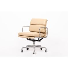 an office chair with wheels on the back and seat upholstered in beige leather