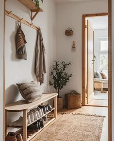 the entryway is clean and ready to be used as a shoe storage area for shoes