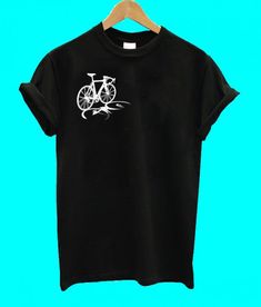 a black t - shirt with a white bicycle on it