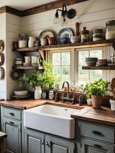 a kitchen filled with lots of pots and pans on top of shelves next to a sink