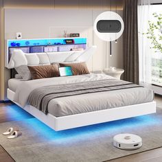 a bed with blue lights on the headboard and foot board in front of it