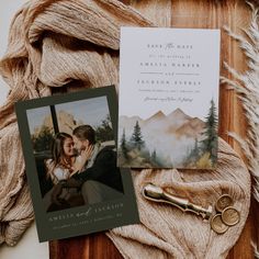 wedding stationery with photo and key laying on top of it next to a scarf