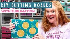 a woman holding up a box with oranges on it and the words diy cutting boards