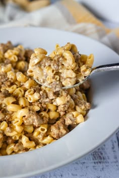 a white bowl filled with macaroni and cheese