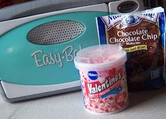 an ice cream and candy bar are sitting on the counter next to a toaster