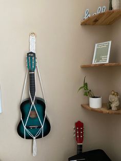 a guitar hanging on the wall in a room