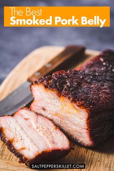 sliced pork on a cutting board with knife and fork next to it, ready to be eaten