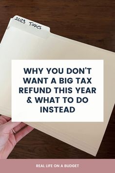 a person holding a piece of paper with the words why you don't want a big tax refund this year and what to do instead