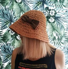 Summer hat made of raffia. Made from 100% natural raffia. Lightweight and folds well, easy to take on the road.  Can be worn with the brim lowered as a bucket hat or as a straw hat with curled edges.  Has a removable brooch. Can be washed by hand in cold water, without twisting, after drying, steam off with an iron. Suitable for head size 54-56cm If you need another size, please send me a message. Brown Brimmed Sun Hat For Summer, Brimmed Brown Summer Sun Hat, Lightweight Brown Hats For Beach Season, Spring Beach Cloche Hat Woven, Lightweight Brimmed Brown Straw Hat, Spring Beach Woven Cloche Hat, Lightweight Brown Brimmed Straw Hat, Brown Brimmed Straw Hat For Summer, Casual Woven Cloche Hat For Beach