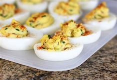 several deviled eggs are sitting on a plate