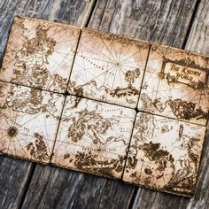 four wooden coasters with an old world map on them