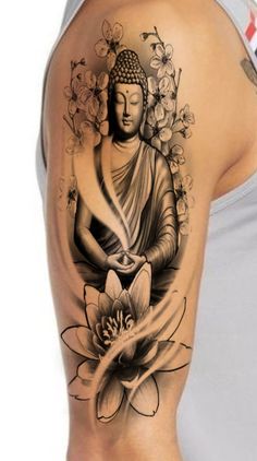 a woman with a tattoo on her arm and shoulder is sitting in front of a flower