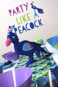 a party like peacock decoration on a table