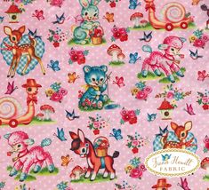 a pink fabric with animals and flowers on it