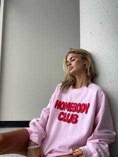 Get cozy in our Homebody Club Pink Crew! Made with a soft cotton blend, this light pink sweatshirt features a bold red 3D puff print graphic that adds a pop of color to your loungewear. Perfect for relaxing at home or running errands, this crewneck will keep you comfortable and stylish all day long. Cozy Home Clothes, Sweatshirt Hoodie, Homebody Sweatshirt, Crewneck Sweatshirt Design Ideas, Wellness Sweatshirt, Artsy Sweatshirt, Sweatshirt Print, Colorful Loungewear, Free People Loungewear