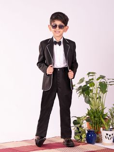 VASTRAMAY Boys' White And Black Shirt Blazer And Pant Get your young one ready for any special occasion with this stylish VASTRAMAY outfit. This set includes a white shirt, a black blazer, and matching pants, creating a smart and sophisticated look. The shirt features a classic collar and button-down front, while the blazer adds a touch of elegance with its tailored design. The pants complete the outfit with a comfortable fit and a versatile black color. Features: Stylish and sophisticated outfi Black Summer Formal Set, Tailored Black Sets For Spring, Black Semi-formal Sets For Spring, Black Semi-formal Spring Set, Black Cotton Party Sets, Casual Black Suits For Spring, Casual Black Spring Suits, Classic Black Sets For Spring, Classic Black Spring Sets