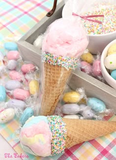 an ice cream cone with sprinkles and eggs in it on a table