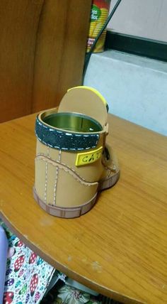 a pair of shoes sitting on top of a wooden table