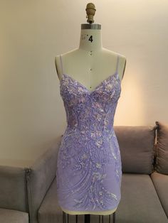 This handcrafted lavender lace mini dress is a unique blend of elegance and artistry. The intricate floral embroidery makes it perfect for memorable occasions like weddings, homecomings, and graduation ceremonies. Designed with meticulous attention to detail, this dress is not just an outfit, but a statement piece that ensures you stand out in any crowd. Lavender Homecoming Dress, Mini Dress Elegant, Special Event Outfit, Elegant Floral Wedding, Embroidered Mini Dress, Lavender Dresses, Party Dress Short, Graduation Outfit, Hoco Dresses