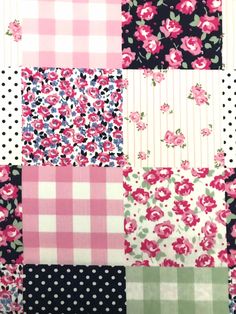 a patchwork quilt with pink flowers and black polka dots on the bottom, green checkered