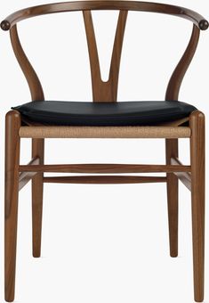 a wooden chair with black leather seat pad