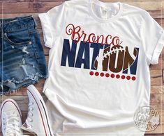 a t - shirt that says tiger nation on it next to denim shorts and sneakers