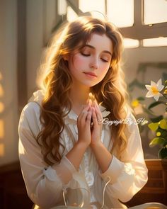 a young woman sitting in front of a cake with candles on it and flowers behind her