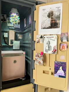 an open refrigerator with magnets and pictures on it